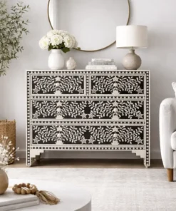 Black floral embossed bone inlay chest of 4 drawers placed in modern living room with furnished