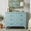 Bone inlay floral design 4 drawer light blue chest of drawer / dresser set in living room with lamp and decor items
