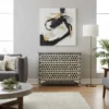 Bone inlay black 4 drawer chest in honeycomb design placed in furnished pale gray living room