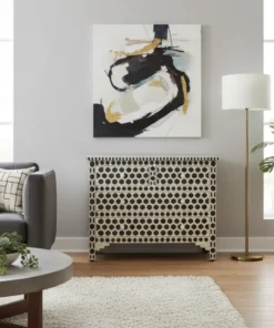 Bone inlay black 4 drawer chest in honeycomb design placed in furnished pale gray living room