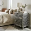 Black Bone Inlay 1 Drawer 1 Door Side Cabinet placed in modern bedroom with pillow and blanket