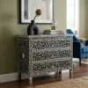 Black Mother of Pearl 3 Drawer Chest styled in modern living room with blue chair and home décor items