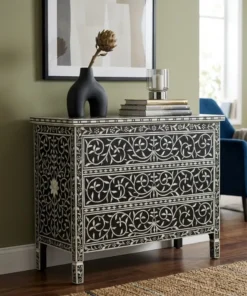 Black Mother of Pearl 3 Drawer Chest styled in modern living room with blue chair and home décor items