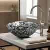 Black Mother of Pearl round hand wash basin with handmade decorative inlay design in modern washroom