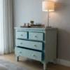 Bone Inlay Chest Of Four Drawer – Chevron Design turquoise color in pale gray modern room with lamp and some decor items