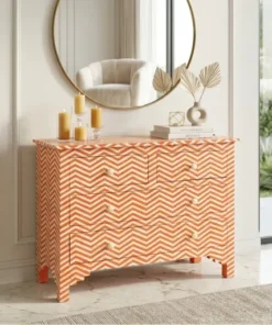 Bone inlay zigzag pattern chest of 4 drawers in luxury modern living room with round mirror and decor items