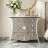 Embossed Bone Inlay Floral 4 Drawer Chest in luxury bedroom with wall mirror and candle and decor items