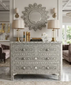 Luxurious grey mother of pearl inlay floral design four drawer chest placed in luxury living room with decorative wall mirror, lamps, and other decor items