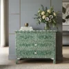 Luxurious Bone inlay floral design 4 drawer chest green color placed in modern living room with decor