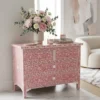 Mother of pearl inlay 4 drawer chest in dark pink placed in modern living room with flower & vase decor