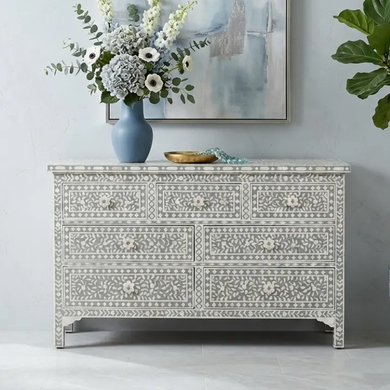 Pale Grey Mother of Pearl 7 Drawer Chest Dresser in modern living room with vase and flower