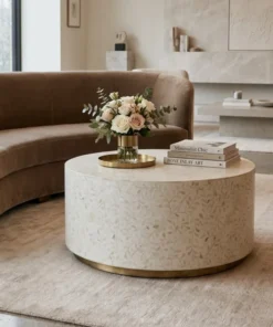 Luxurious White Bone Inlay Round Center Table in minimalist luxury living room with beige sofa and decor items.