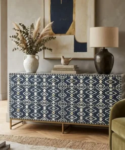 Handmade Navy Blue Bone Inlay Chest of 6 Drawers featuring an elegant Ikkat Design placed in modern living room with green chair and decor items