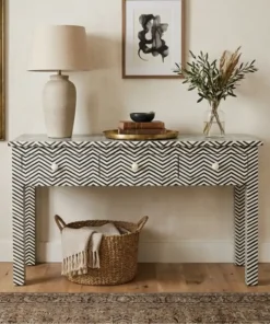 black and white bone inlay 3 drawer console table with home decor items