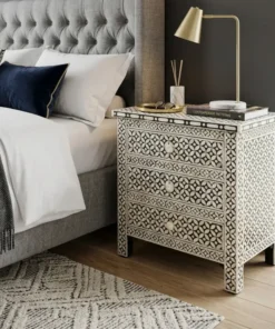 Black Bone Inlay Nightstand Geometric Eye Design placed in bedroom with lemp