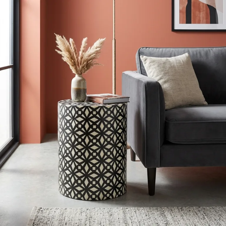Bone Inlay Black Geometric Design Side Table for modern living room with grey sofa and vase decor.