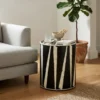 Handmade black bone inlay zigzag pattern side table in modern living room with grey sofa and plant