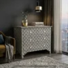 Black & White Bone Inlay Chest of 4 Drawers placed in modern living room with chair and décor items