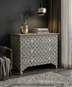 Black & White Bone Inlay Chest of 4 Drawers placed in modern living room with chair and décor items