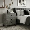 Bone Inlay Bedside In Black Nest Pattern in modern bedroom with bed and decor