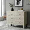 Bone Inlay Chest of 4 Drawers in modern living room with wall decor and chair