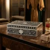 Classic black bone inlay floral jewelry storage box in luxury vanity room with items