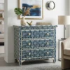 Navy Blue Bone Inlay 3 Drawer Chest placed in modern living room with home decor items and sofa