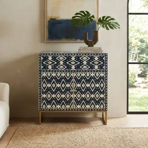 Handmade navy blue bone inlay storage cabinet in modern living room with decor items