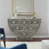 Bone inlay curved shape console cum cabinet black color in modern living room with wall mirror