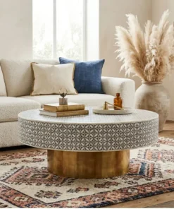 Round bone inlay coffee tale place in bohemian living room setup with sofa and rugs