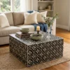 Modern living room with a Black Mother of Pearl Lilly Design Coffee Table and decor items