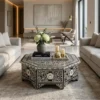 Bone Inlay Black Floral Coffee Table With Storage placed in luxury living room with grey sofa and decor items books, vase, and candles