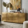 Plain brass cladding 4 door sideboard placed in modern living room