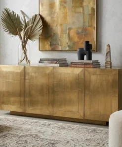 Plain brass cladding 4 door sideboard placed in modern living room
