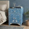 Mother of pearl blue bedside table with 1 drawer 2 door styled in bedroom with decor items