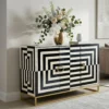 Black & white bone inlay sideboard in modern living room with vase and sofa