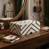 Black and white bone inlay stripe pattern jewelry box placed in modern vanity room