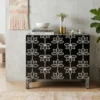 Black bone inlay lotus floral design sideboard placed in modern room with books, vase and plant