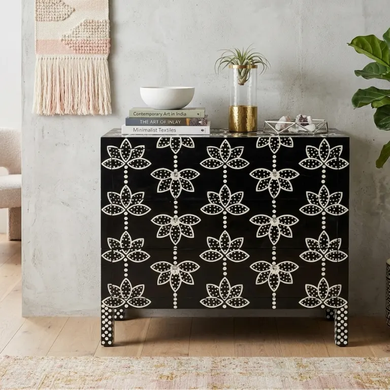black-bone-inlay-lotus-floral-design-sideboard Black bone inlay lotus floral design sideboard placed in modern room with books, vase and plant