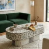 Mother of pearl white oval shape coffee table Floral design with green sofa and decor items