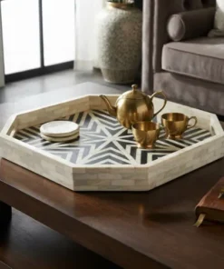 Black and white bone inlay decorative serving tray on brown coffee table