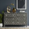 Handmade Bone Inlay 4 Drawer Geometrical Design Sideboard placed in modern living room with decor items