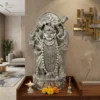 Handmade Silver lord shrinathji statue placed at modern living room with flower and pooja items