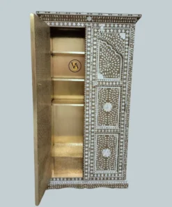 Open door side view showing cupboard storage and brass work
