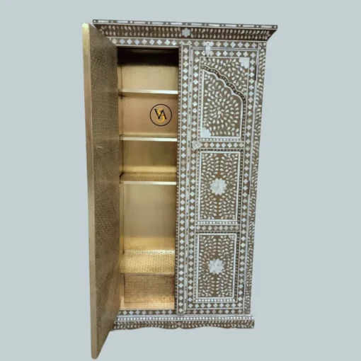 Open door side view showing cupboard storage and brass work