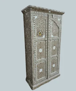 Angled side view of intricately designed inlay wooden cupboard