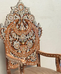Side view of Royal Throne Chair showing detailed inlay on armrest and back