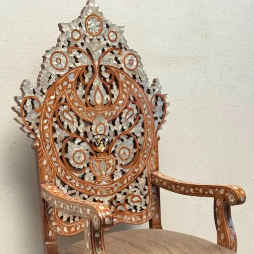 Side view of Royal Throne Chair showing detailed inlay on armrest and back