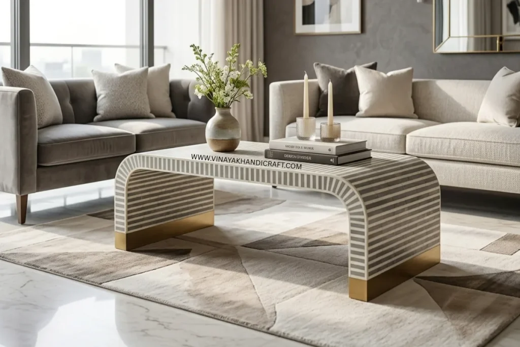 Grey bone inlay waterfall coffee table in a luxury living room with decor items