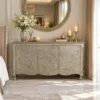 Luxury German silver rose floral storage cabinet with detailed handcrafted design placed in luxury bedroom with decor items
